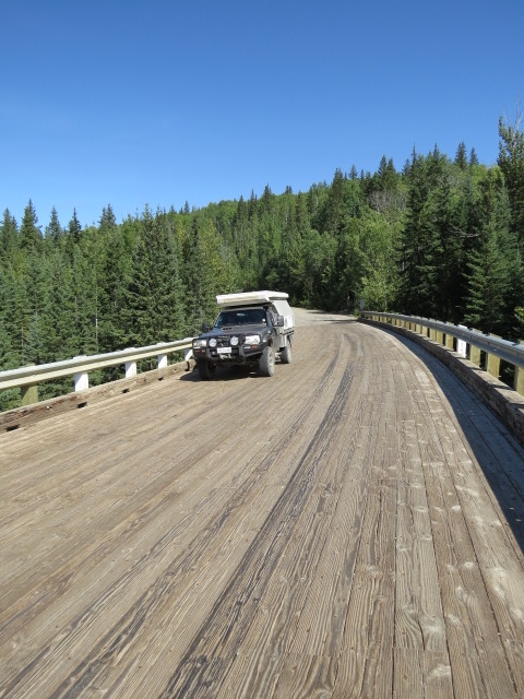 Historic Kiskatinaw Bridge - a curved timber bridge on the original Alaska Highway 